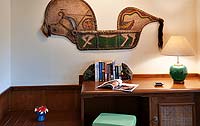 Artwork hangs on the wall in the room