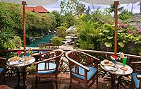 Food on tables with pool in background